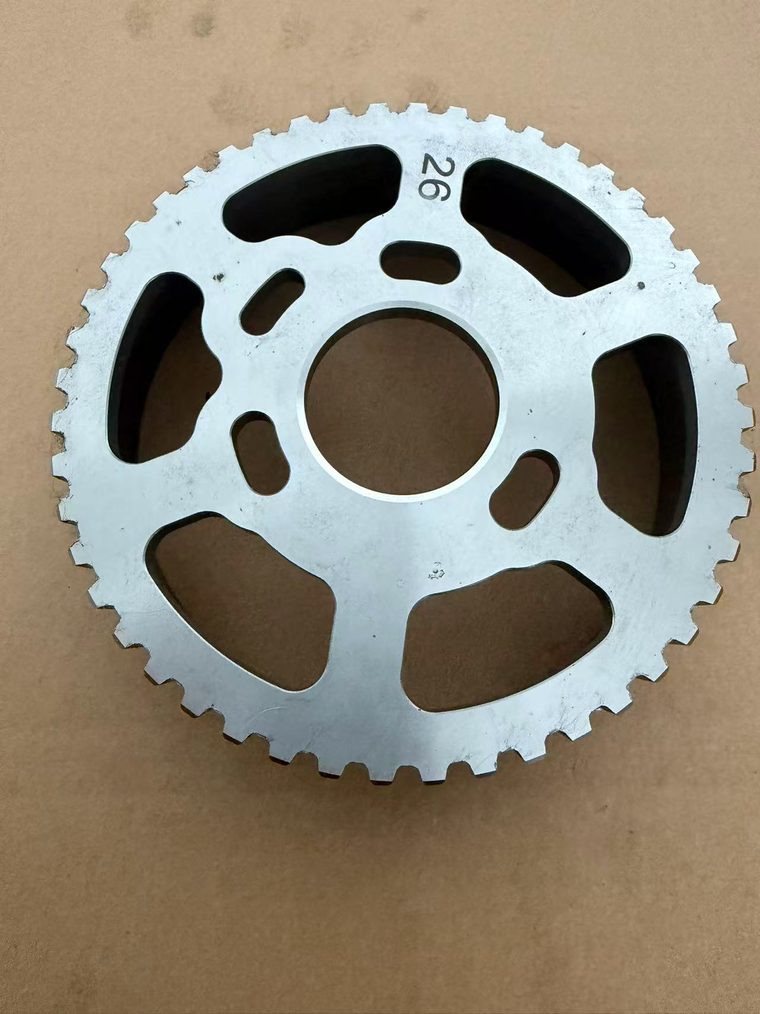Steel timing pulley with lightening windows, machined teeth and keyway for an automotive drive