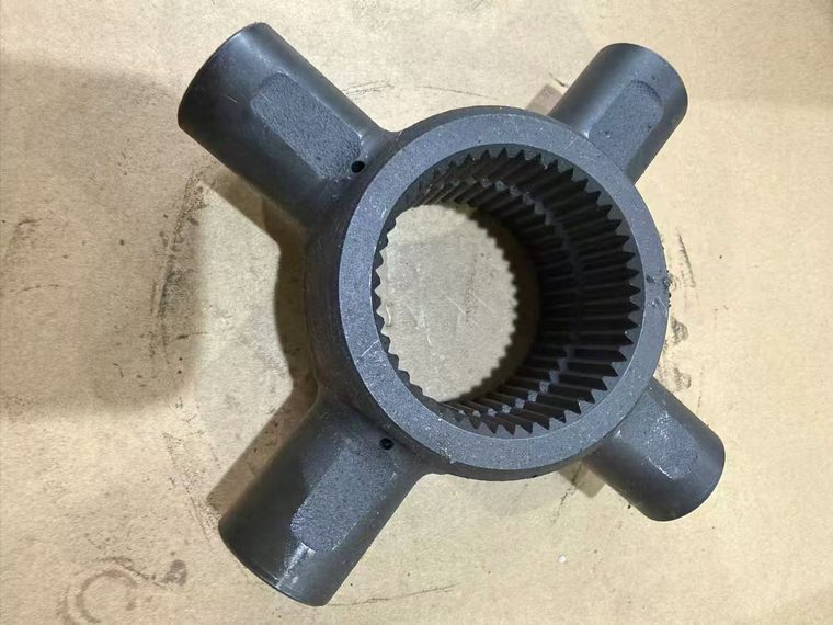 Cast universal joint cross with four trunnions and internal spline for an automotive propshaft