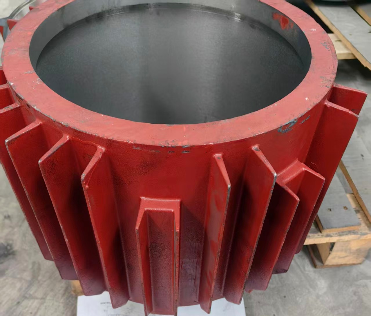 Machined cast iron end shield for an electric motor — precision bore and mounting face