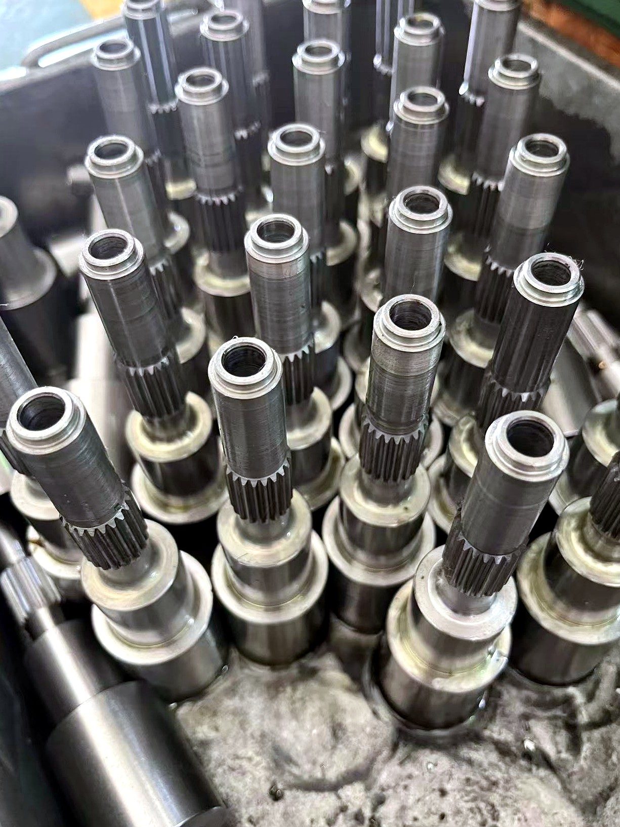 Machined gear shafts and spline shafts for crane travel mechanisms